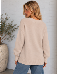 Back view of the Cloud Spun V-Neck Sweater in frosted pearl, featuring a relaxed silhouette, drop shoulders and wide ribbed hem.