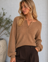 Close-up of the camel Cozy Henley Sweater highlighting its plush brushed knit texture, Henley neckline and button-front detail.