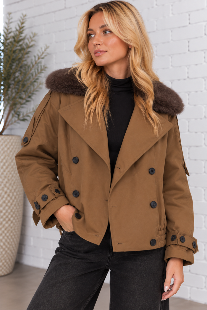 Model wearing the Fur Collar Trench Jacket in teak brown, featuring a dark brown faux fur collar, double-breasted buttons, and a cropped silhouette.