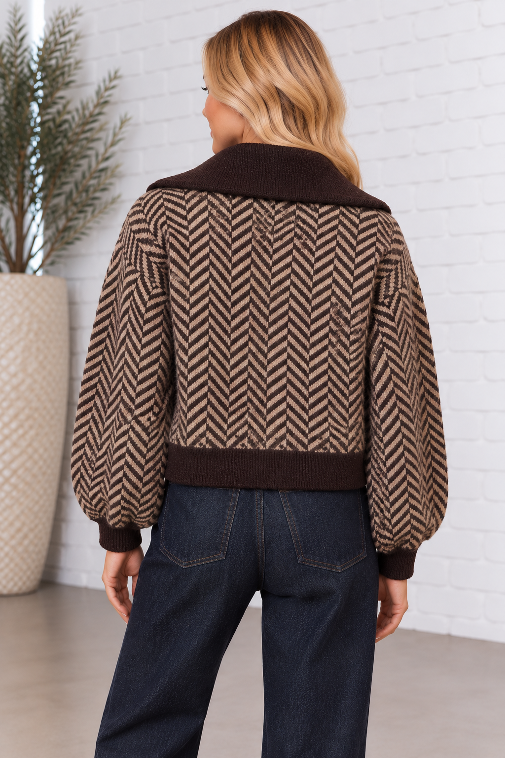 Back view of the Herringbone Zip Front Cardigan in chocolate brown and taupe, featuring an allover herringbone pattern, oversized collar, balloon sleeves, and contrasting ribbed hem.