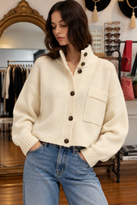 Ivory high neck button cardigan with oversized fit, chest pocket and ribbed trim styled with denim