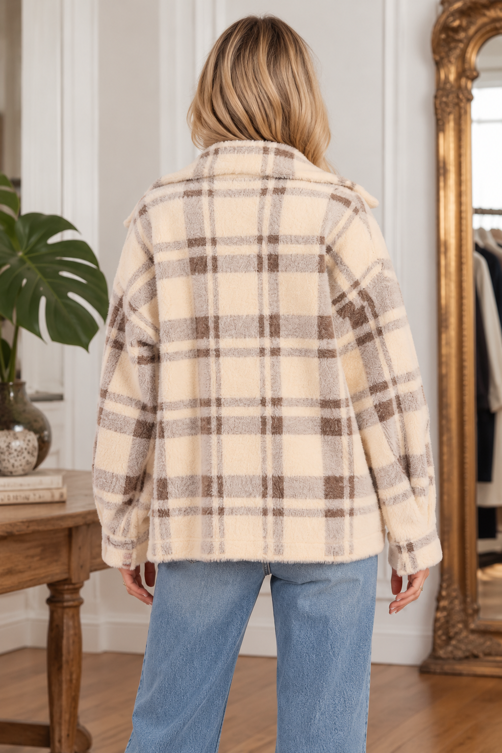 Back view of the Lola Plaid Coat in cream and brown, featuring a soft fuzzy texture, oversized fit, long sleeves, and classic plaid pattern.
