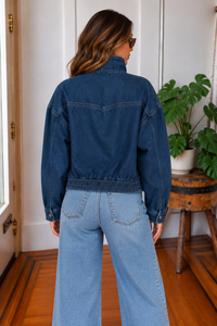 Back view of Phantom Rush denim jacket with oversized fit, back yoke and elastic hem