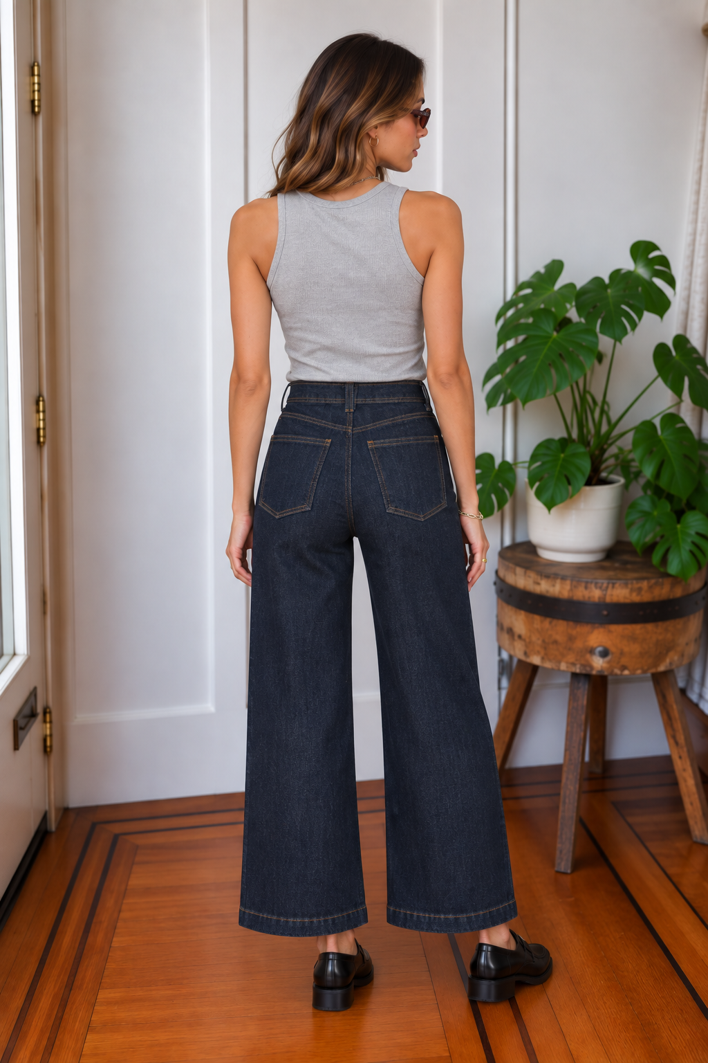 Back view of Valley Girl dark rinse wide-leg jeans with contrast stitching and back patch pockets